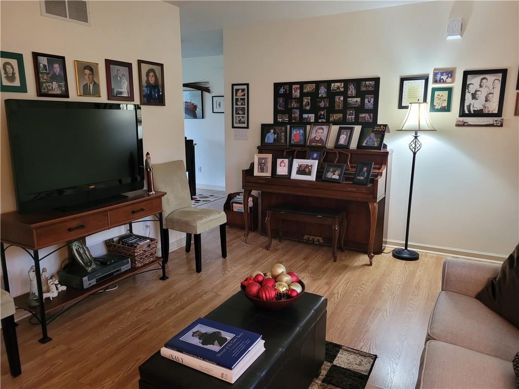 662 Great Belt Road Butler, PA 16002 - Photo 8 of 25 a living room with furniture and a flat screen tv