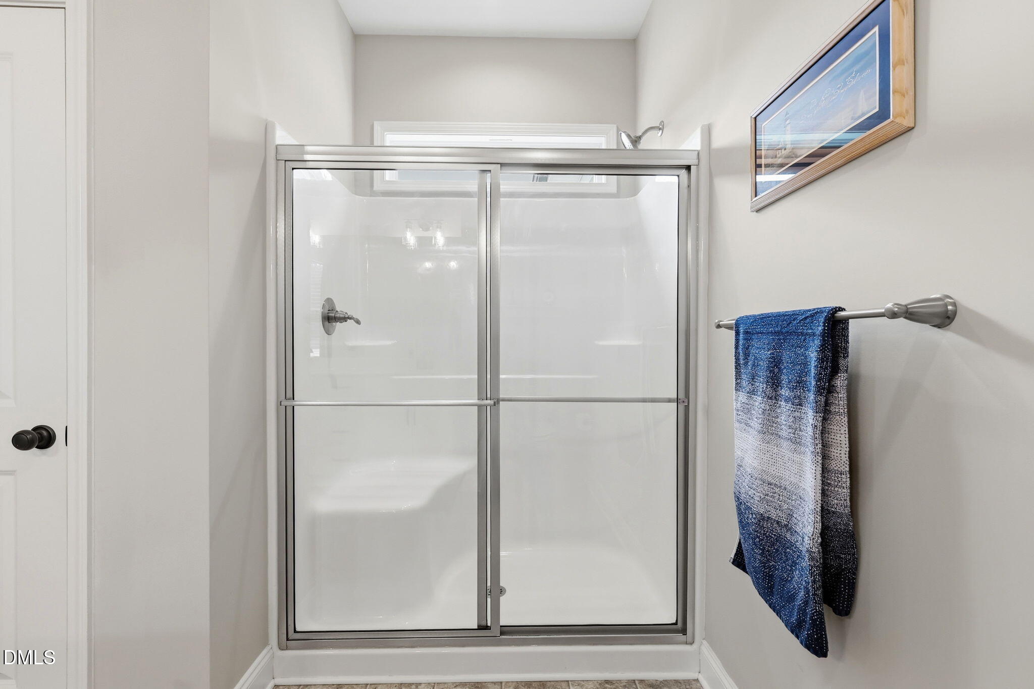 5098 Spring Hill Church Road Lillington, NC 27546 - Photo 17 of 36 a bathroom with a glass shower door