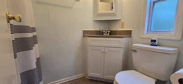 a bathroom with a sink toilet and vanity