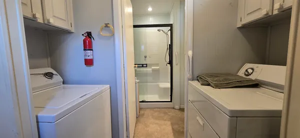 a storage room with washer and dryer