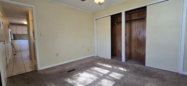 a view of a balcony with wooden floor