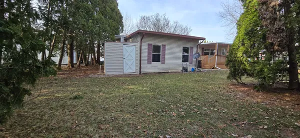 a view of a porch with wooden floor