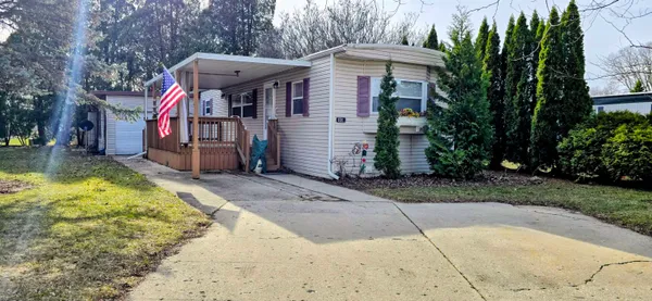 a view of a backyard with large trees