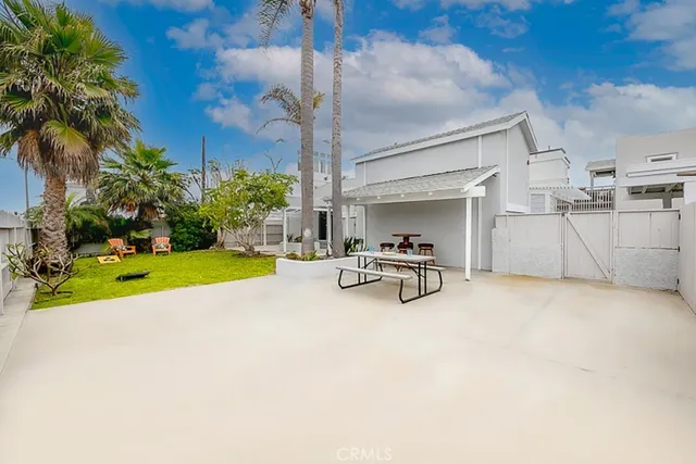 a view of a bench in the garden near a lake