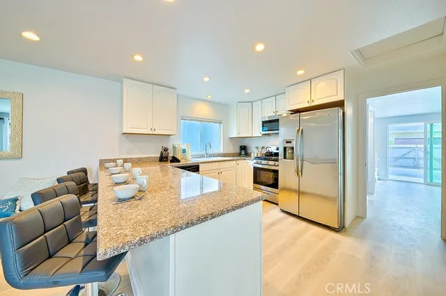 a living room with furniture and flat screen tv