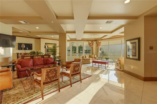 a living room with lots of furniture and a large window