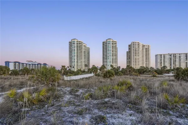 a view of a city with tall buildings in the background