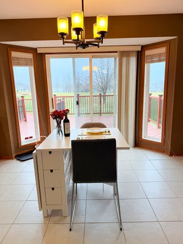 a room with a table and chairs