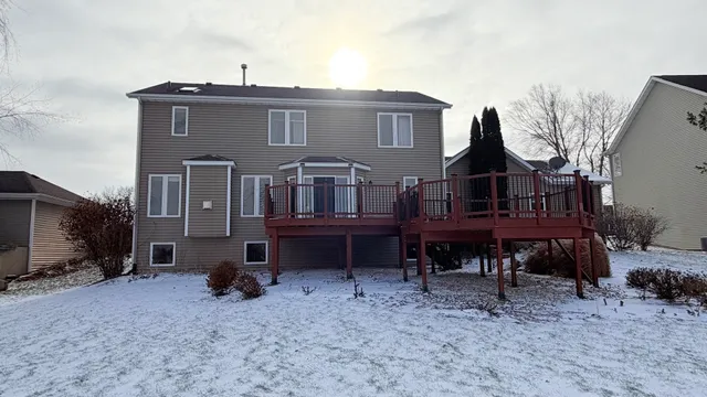 a view of a house with a yard and sitting area