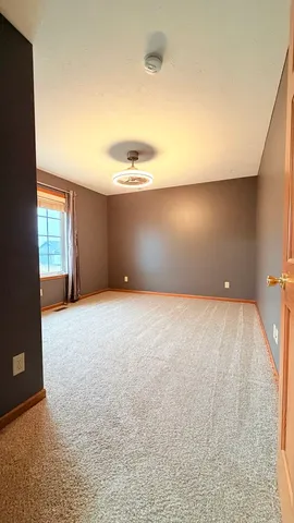 a spacious bathroom with a double vanity sink a mirror and a bathtub
