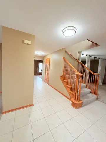 a view of entryway with stairs