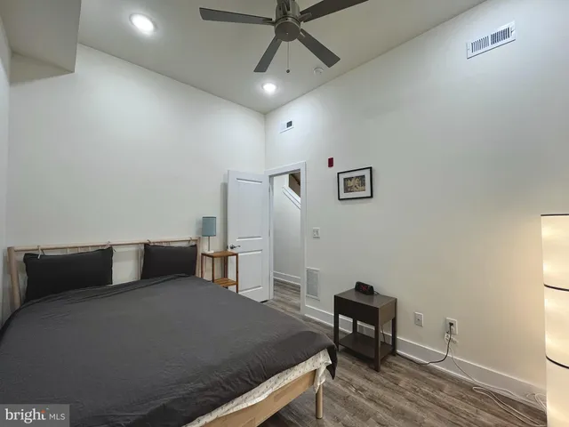 a bathroom with a sink a toilet a mirror and vanity