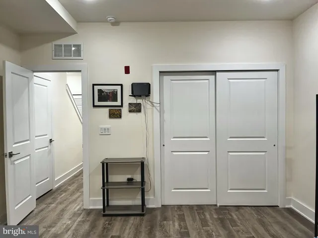 a view of kitchen with furniture and wooden floor