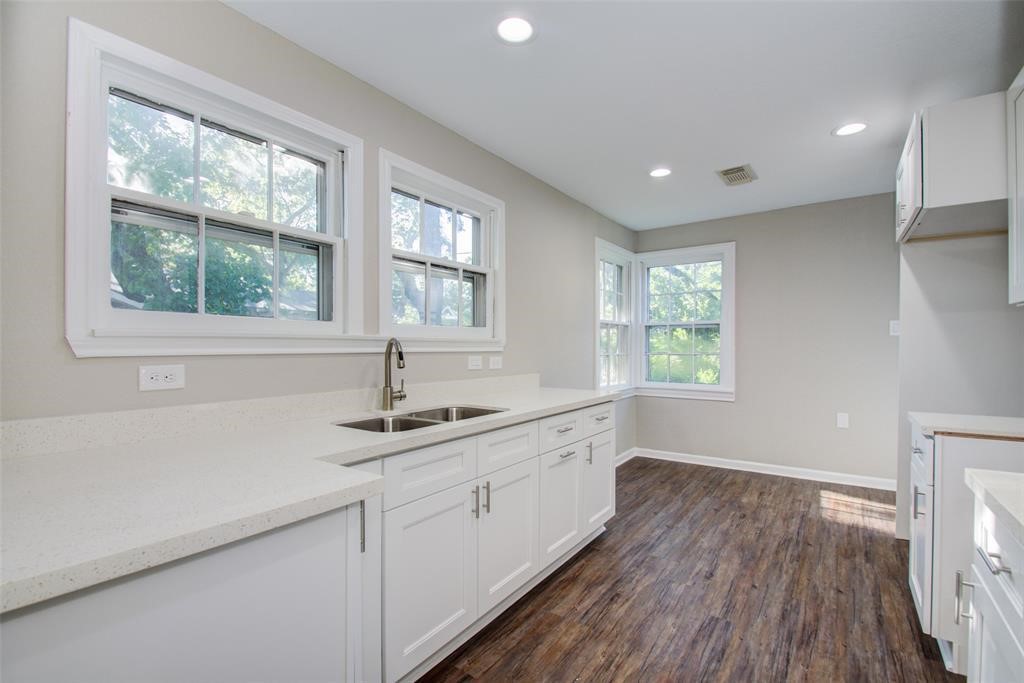 a kitchen with sink and window