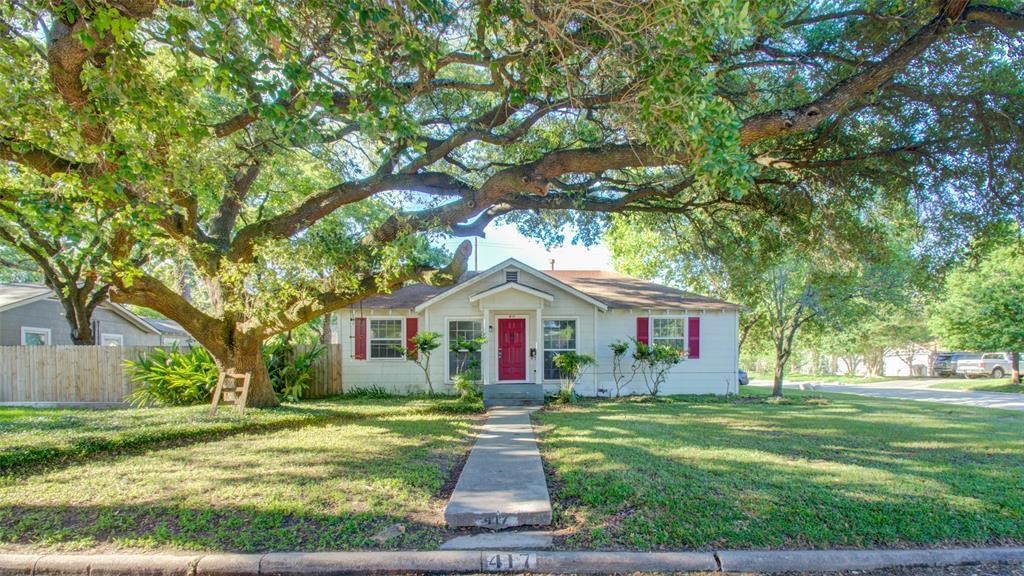417 Sue Street, Unit A Houston, TX 77009 - Photo 2 of 11 a front view of a house with yard and green space