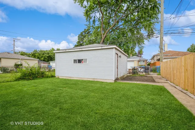 a view of a backyard with plants and a patio
