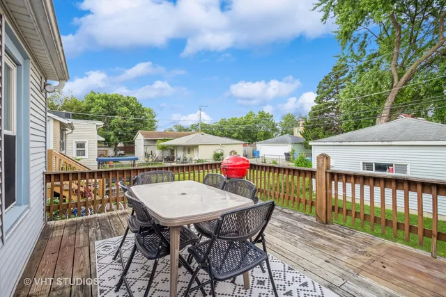 a view of a chairs and table on the deck