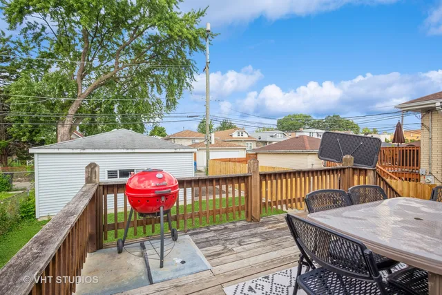 a view of a roof deck with furniture