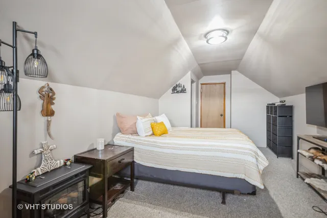 a bedroom with a bed and gym equipment