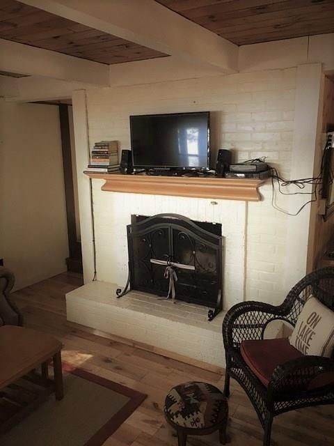 302 Timber Point Road Belgrade, ME 04917 - Photo 9 of 30 Living room brick fireplace.