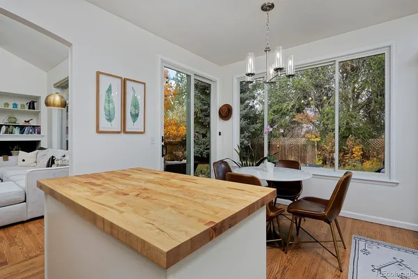 a view of a dining room with furniture window and outside view