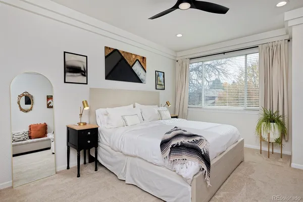 a bedroom with a bed and window