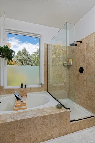 a room with a window and ceiling fan