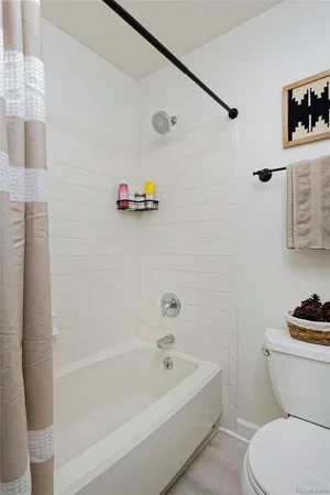 a bathroom with a bathtub and a toilet