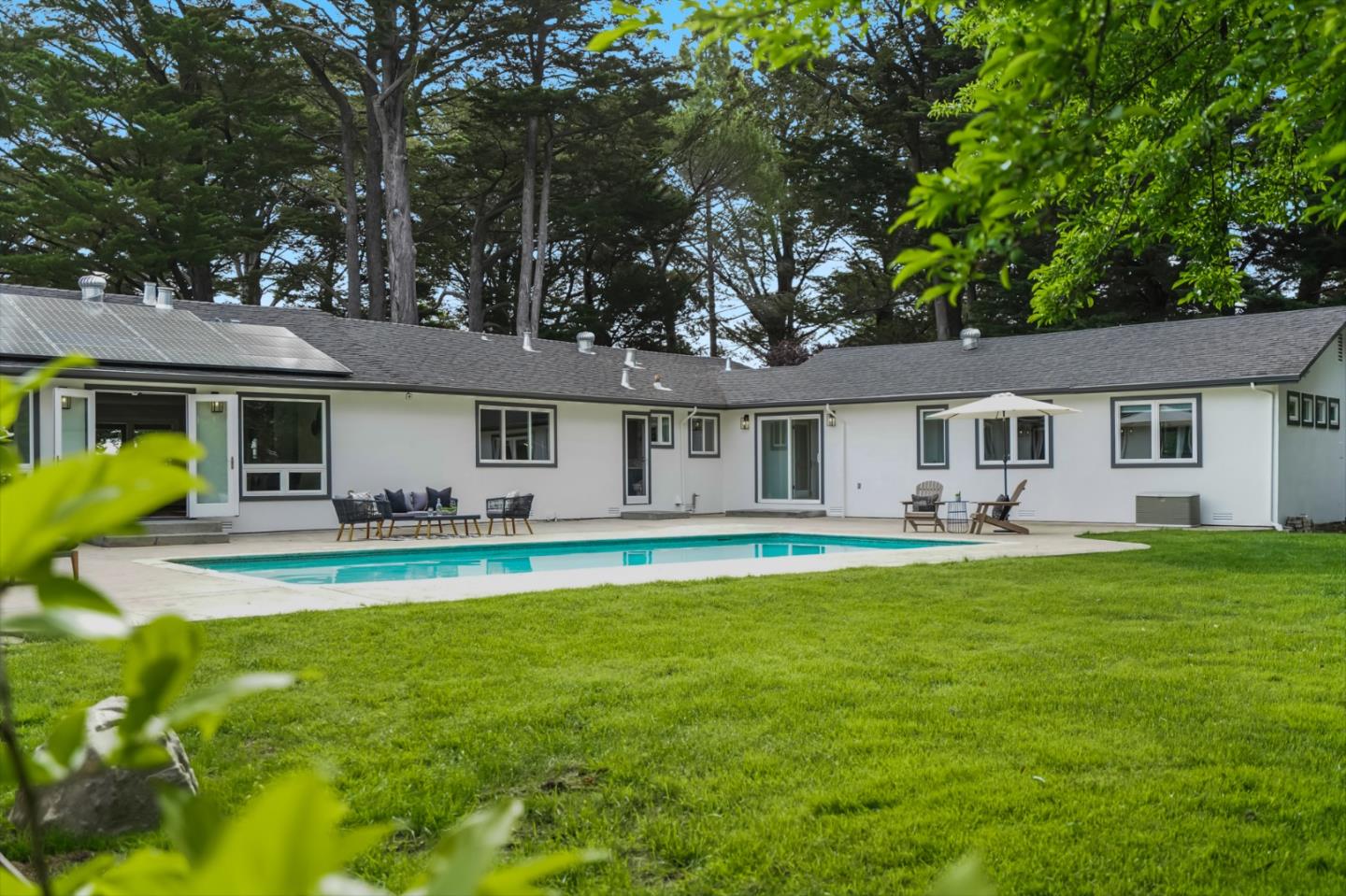 309 Darrell Road Burlingame, CA 94010 - Photo 12 of 94 a front view of a house with swimming pool and porch with furniture