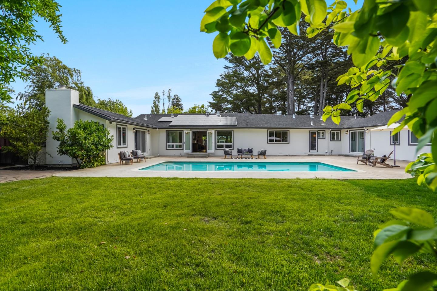 309 Darrell Road Burlingame, CA 94010 - Photo 13 of 94 a front view of a house with swimming pool having outdoor seating
