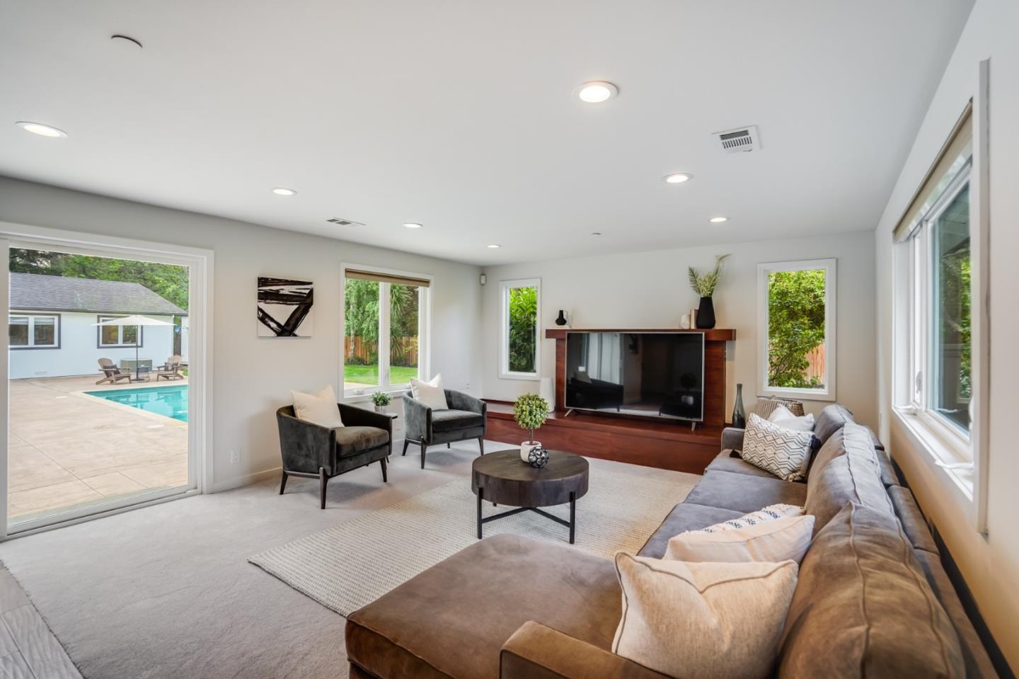 309 Darrell Road Burlingame, CA 94010 - Photo 19 of 94 a living room with furniture and a flat screen tv