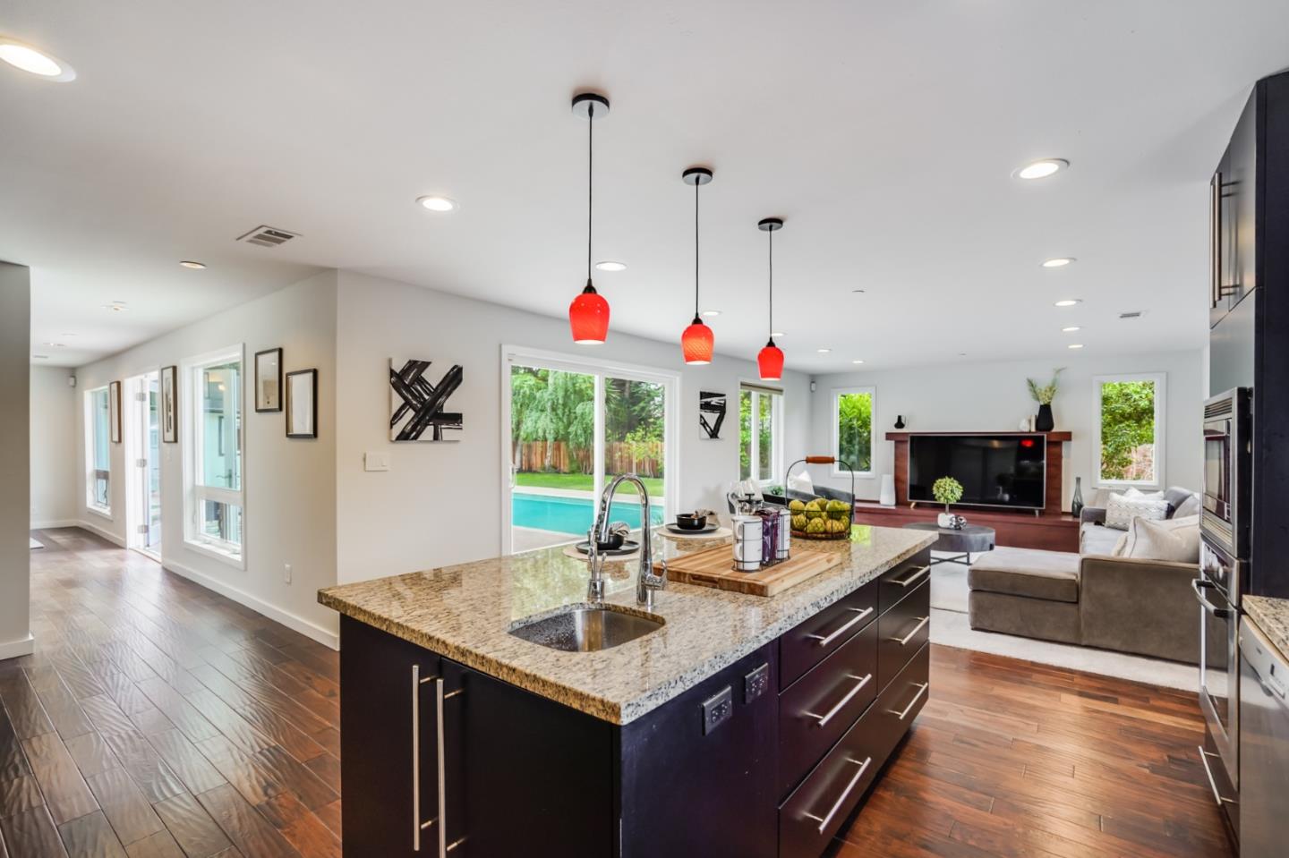 309 Darrell Road Burlingame, CA 94010 - Photo 24 of 94 a kitchen with stainless steel appliances granite countertop a stove and a wooden floors
