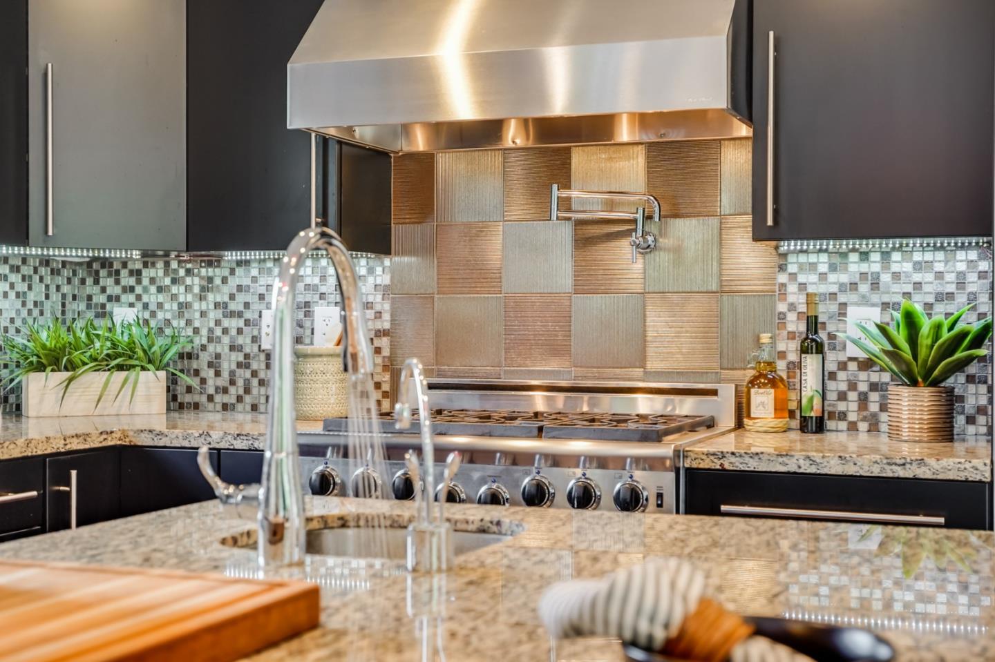 309 Darrell Road Burlingame, CA 94010 - Photo 28 of 94 a view of kitchen with kitchen island stainless steel appliances a sink and a counter top space