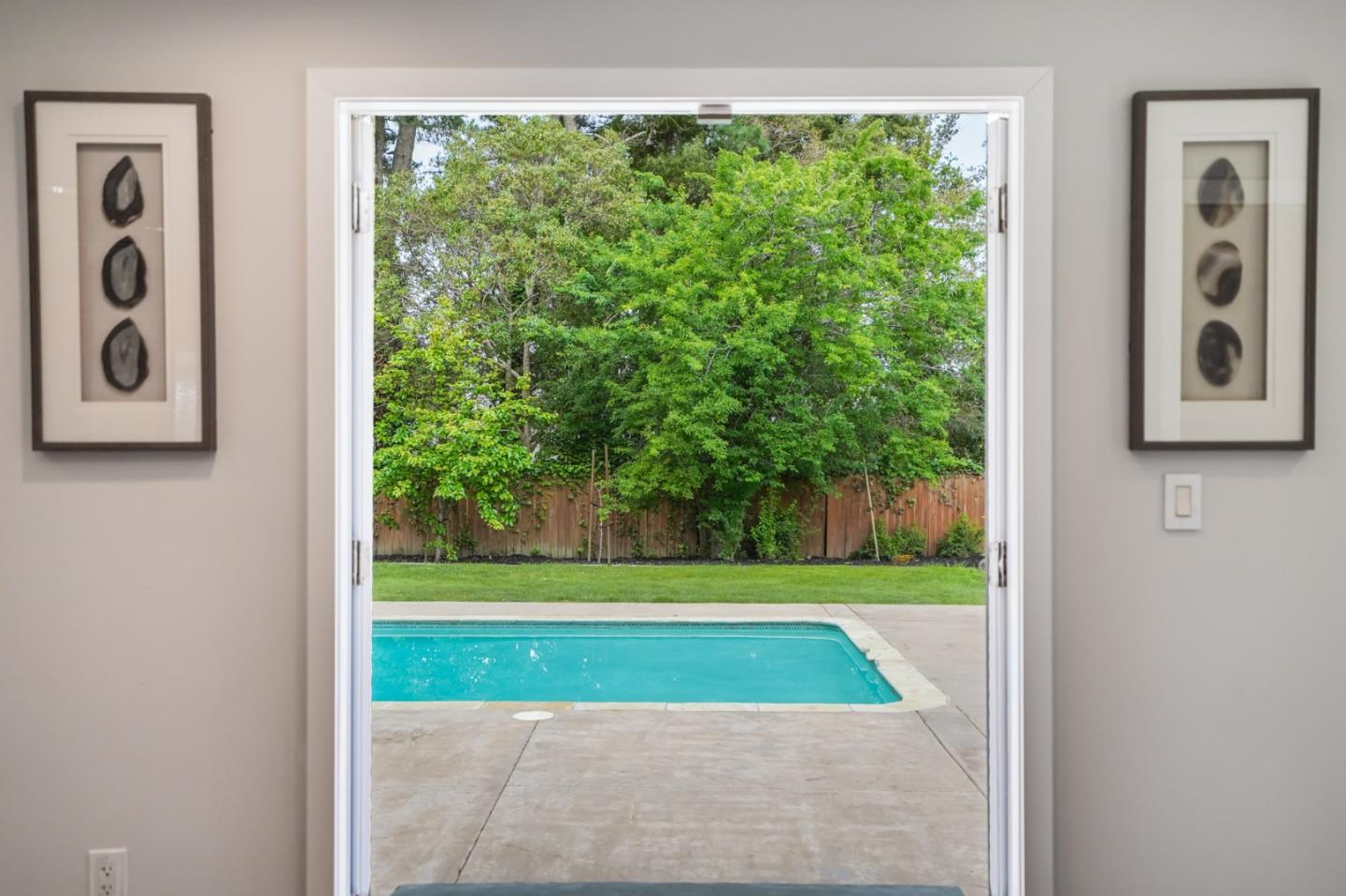 309 Darrell Road Burlingame, CA 94010 - Photo 35 of 94 a view of a room that has a bed window and a yard