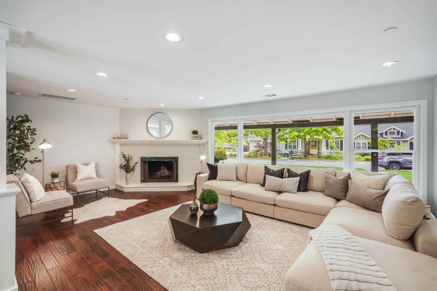 309 Darrell Road Burlingame, CA 94010 - Photo 40 of 94 a living room with furniture a fireplace and a large window