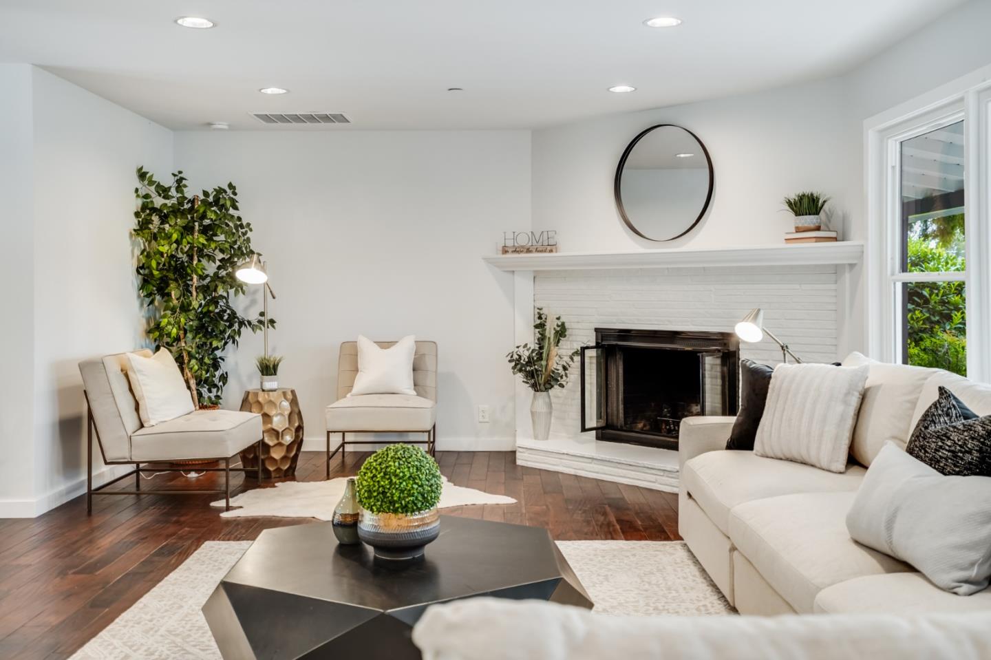 309 Darrell Road Burlingame, CA 94010 - Photo 42 of 94 a living room with furniture a fireplace and a potted plant