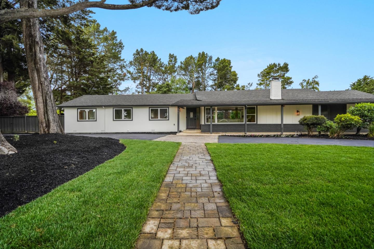309 Darrell Road Burlingame, CA 94010 - Photo 5 of 94 a front view of a house with a yard