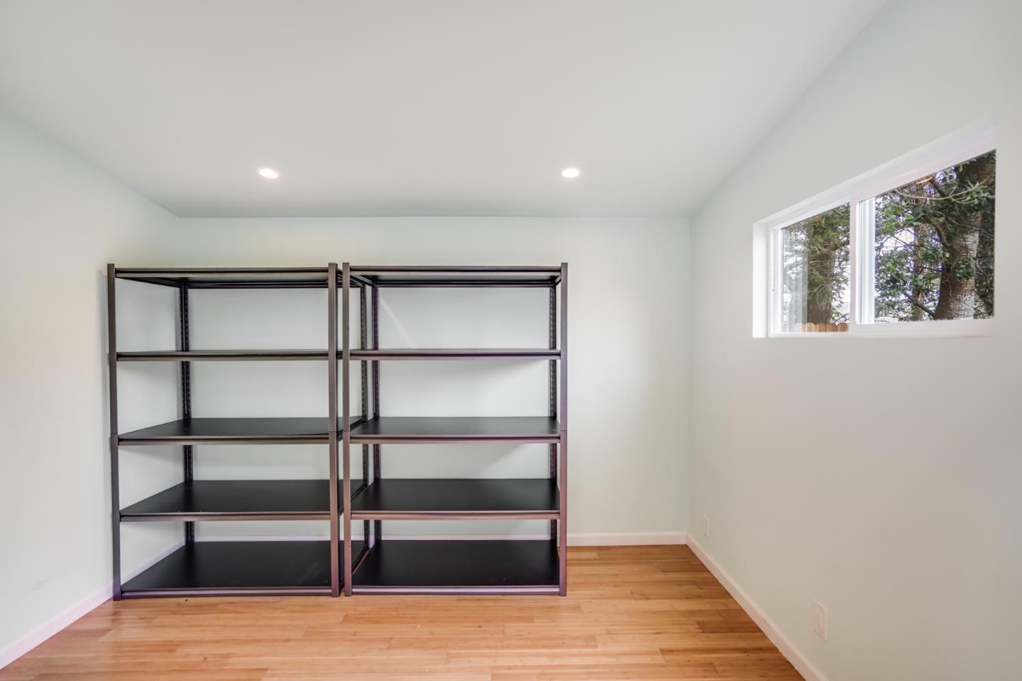 309 Darrell Road Burlingame, CA 94010 - Photo 77 of 94 a view of a room with wooden floor and window