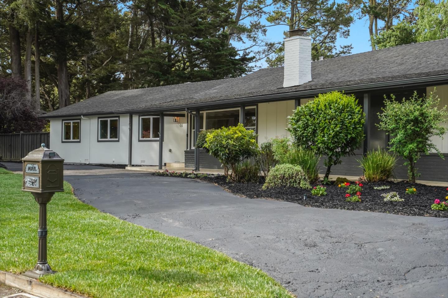 309 Darrell Road Burlingame, CA 94010 - Photo 85 of 94 a front view of a house with a yard and potted plants