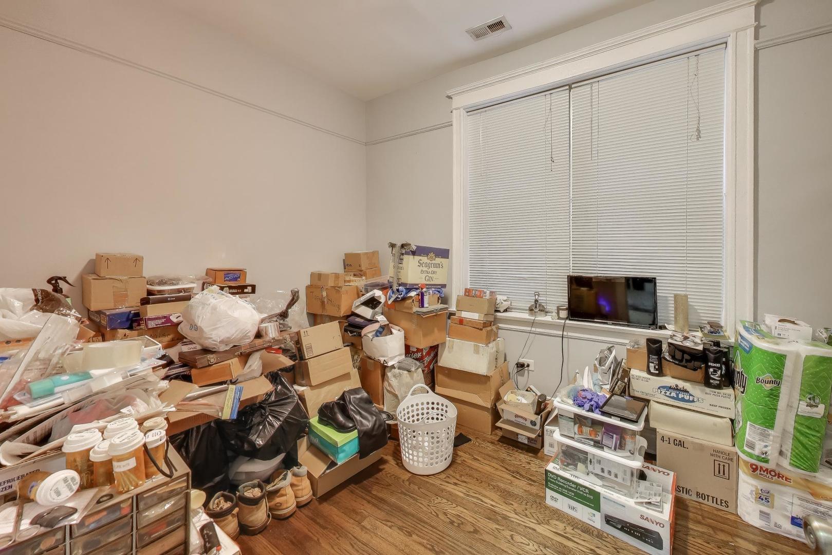 6149 South Rhodes Avenue Chicago, IL 60637 - Photo 15 of 50 a living room with lots of furniture and a wooden floor