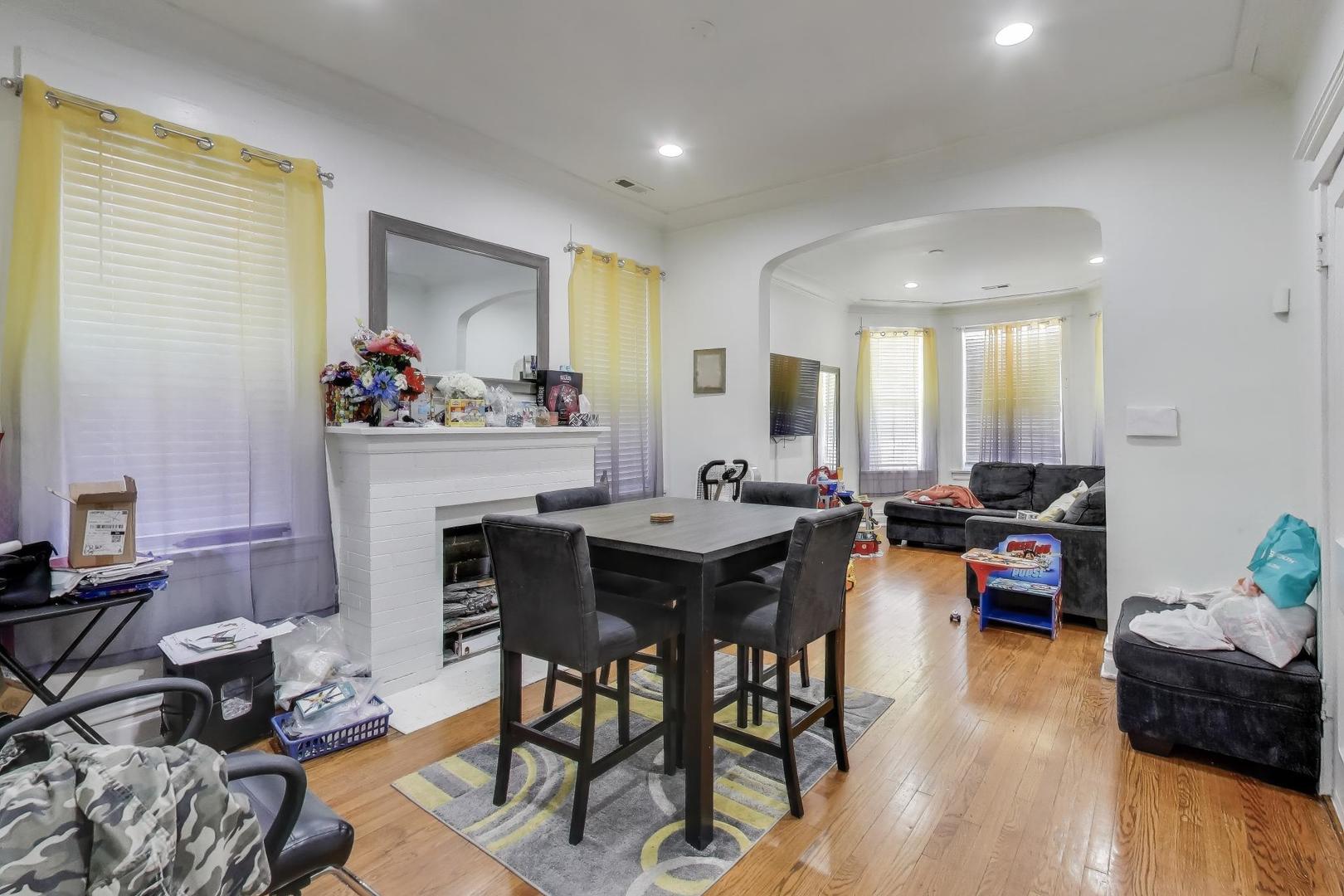6149 South Rhodes Avenue Chicago, IL 60637 - Photo 21 of 50 a view of a dining room with furniture and wooden floor