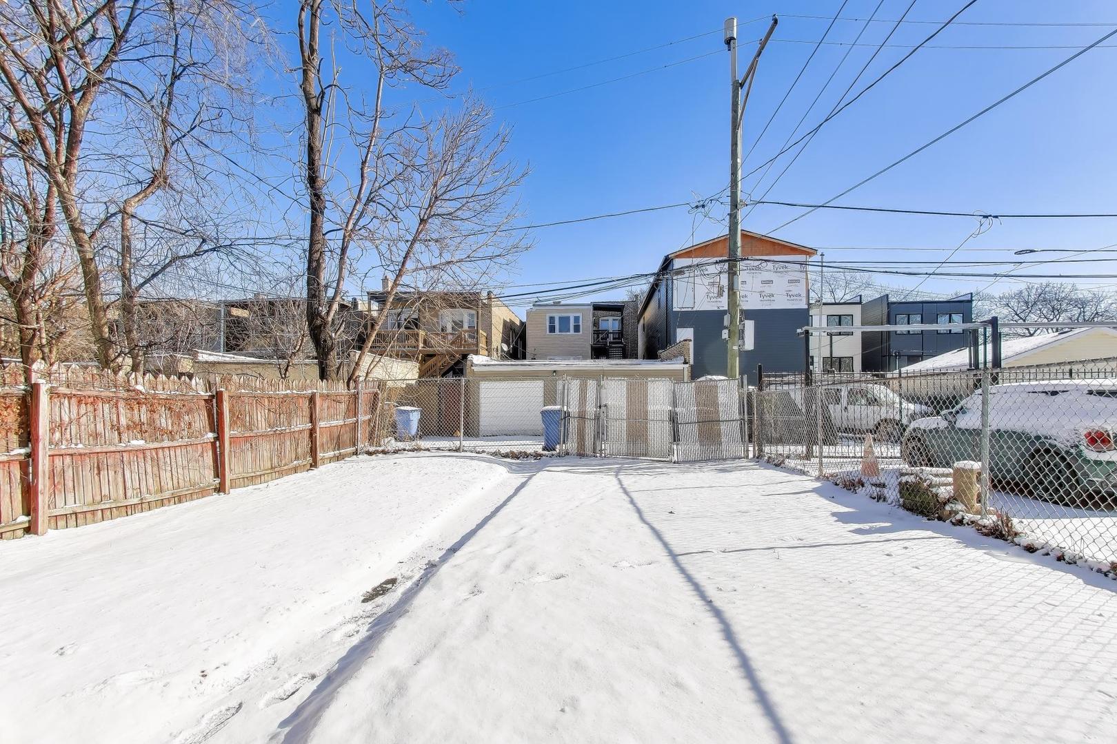 6149 South Rhodes Avenue Chicago, IL 60637 - Photo 45 of 50 a view of a house with a yard