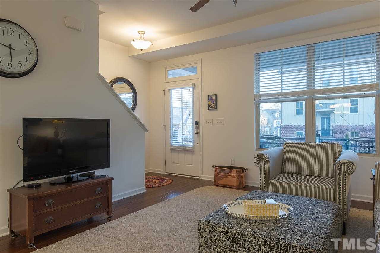 1607 Crafton Way Raleigh, NC 27607 - Photo 3 of 17 a living room with furniture and a flat screen tv