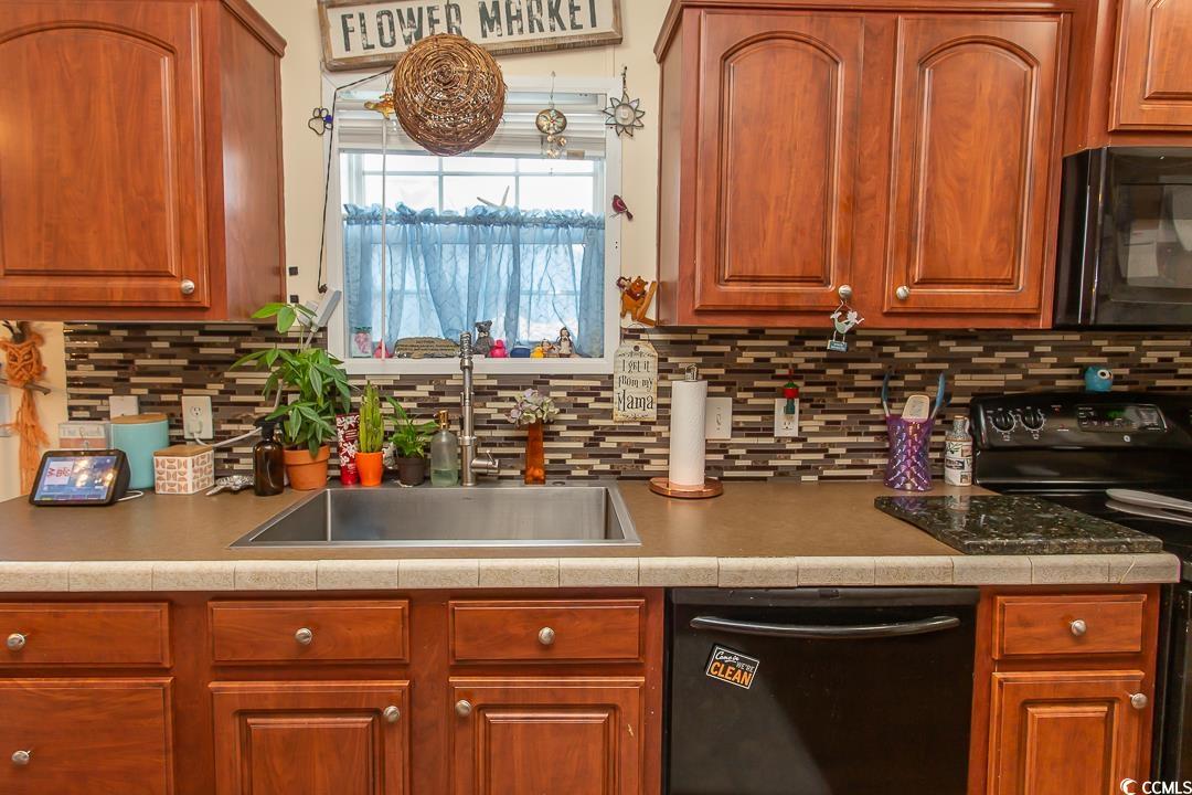 1051 Hunter Way Conway, SC 29526 - Photo 12 of 27 Kitchen featuring sink, decorative backsplash, and