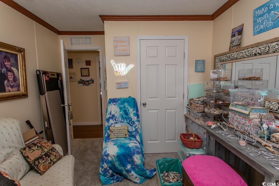 1051 Hunter Way Conway, SC 29526 - Photo 22 of 27 Bedroom featuring crown molding, carpet flooring,