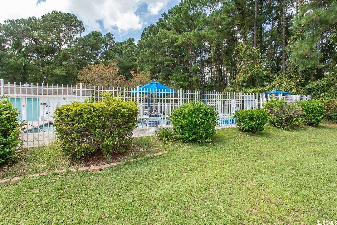 1051 Hunter Way Conway, SC 29526 - Photo 25 of 27 View of yard with a fenced in pool