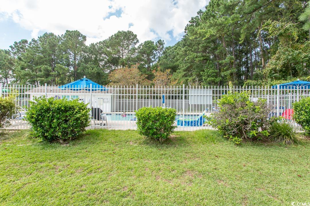 1051 Hunter Way Conway, SC 29526 - Photo 26 of 27 View of swimming pool with a lawn