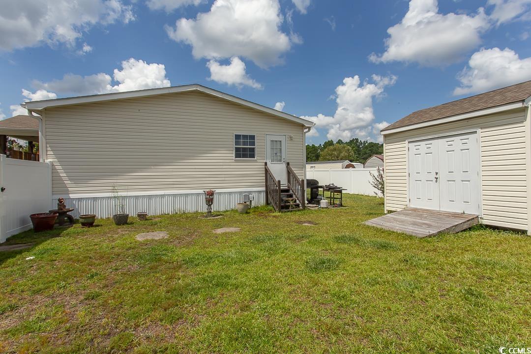 1051 Hunter Way Conway, SC 29526 - Photo 5 of 27 Rear view of house with a yard