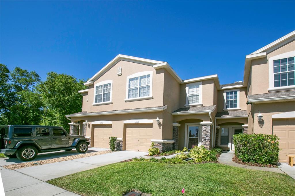 a front view of a house with a yard