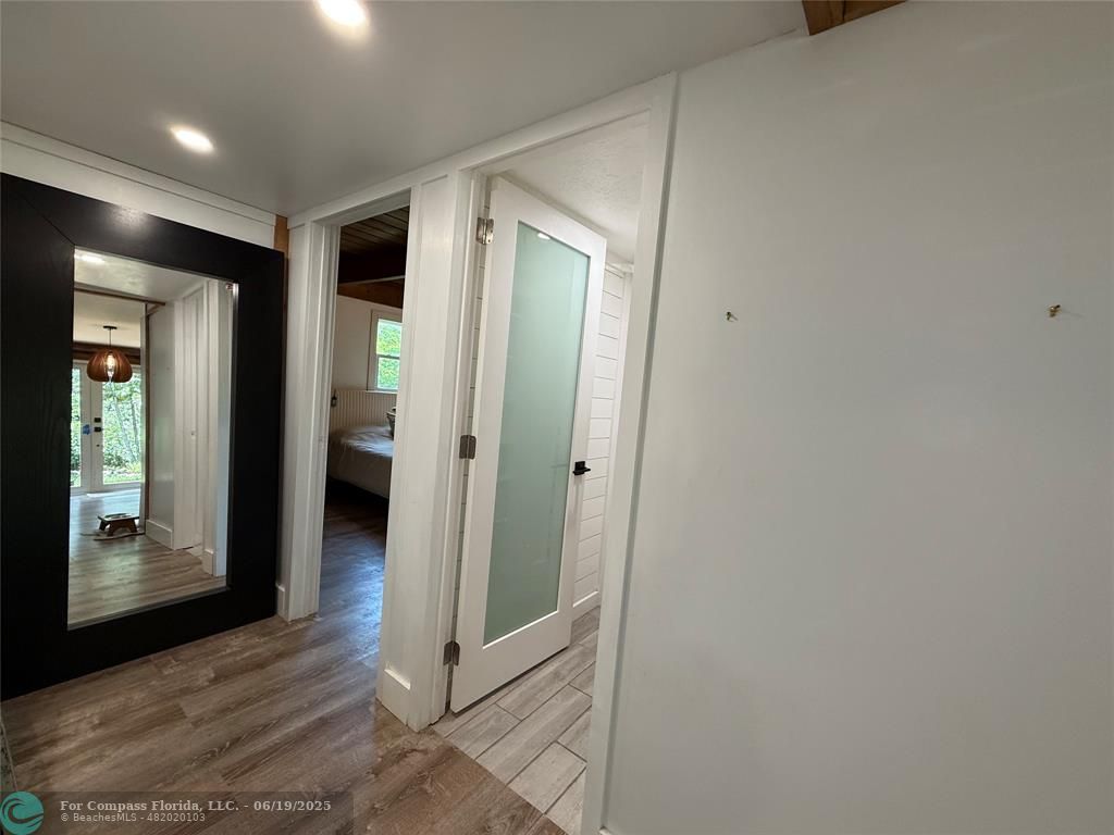 22990 Southwest 156th Avenue Miami, FL 33170 - Photo 15 of 41 a view of a hallway with wooden floor and closet
